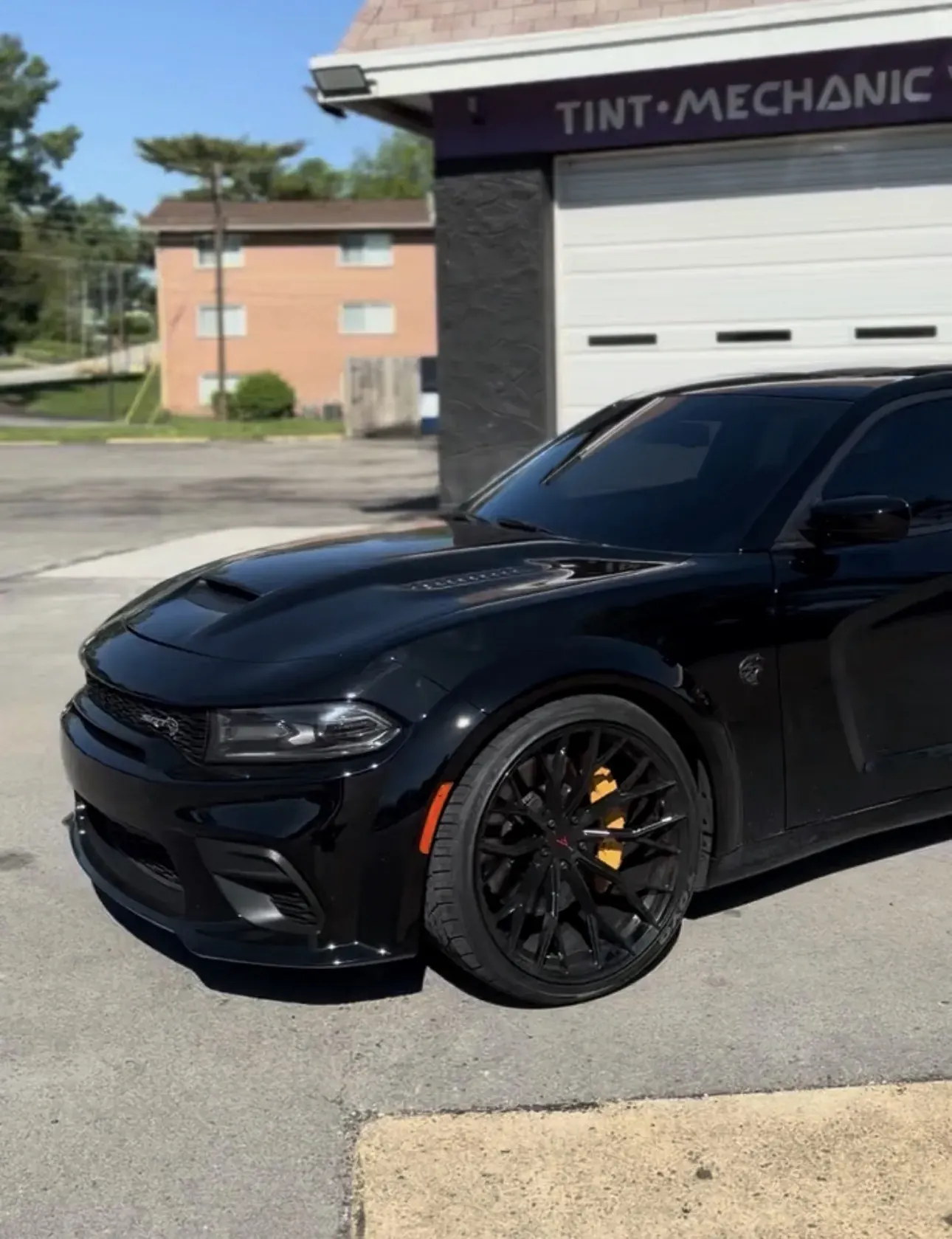Black Dodge Charger with orange painted calipers