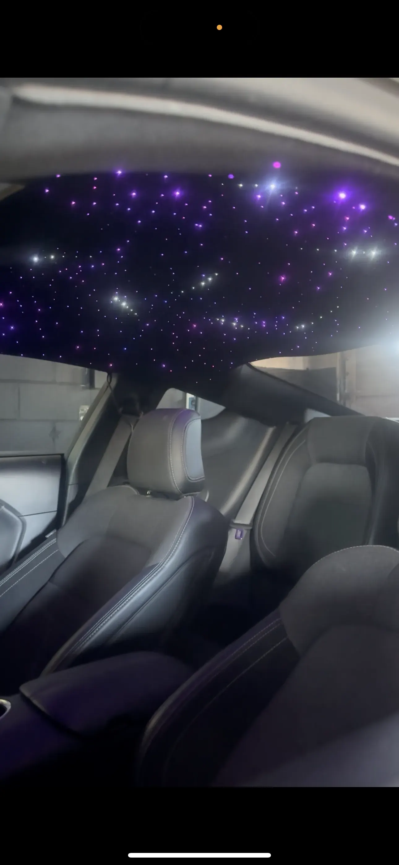 Purple starlight headliner above the front seats
