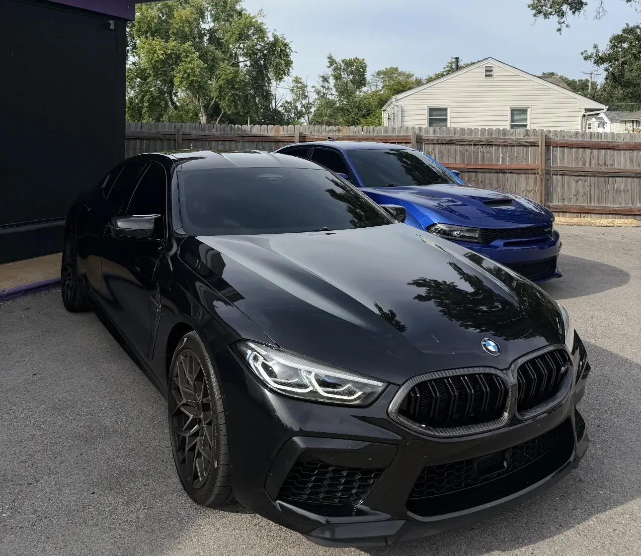 Black BMW M8 with window tint