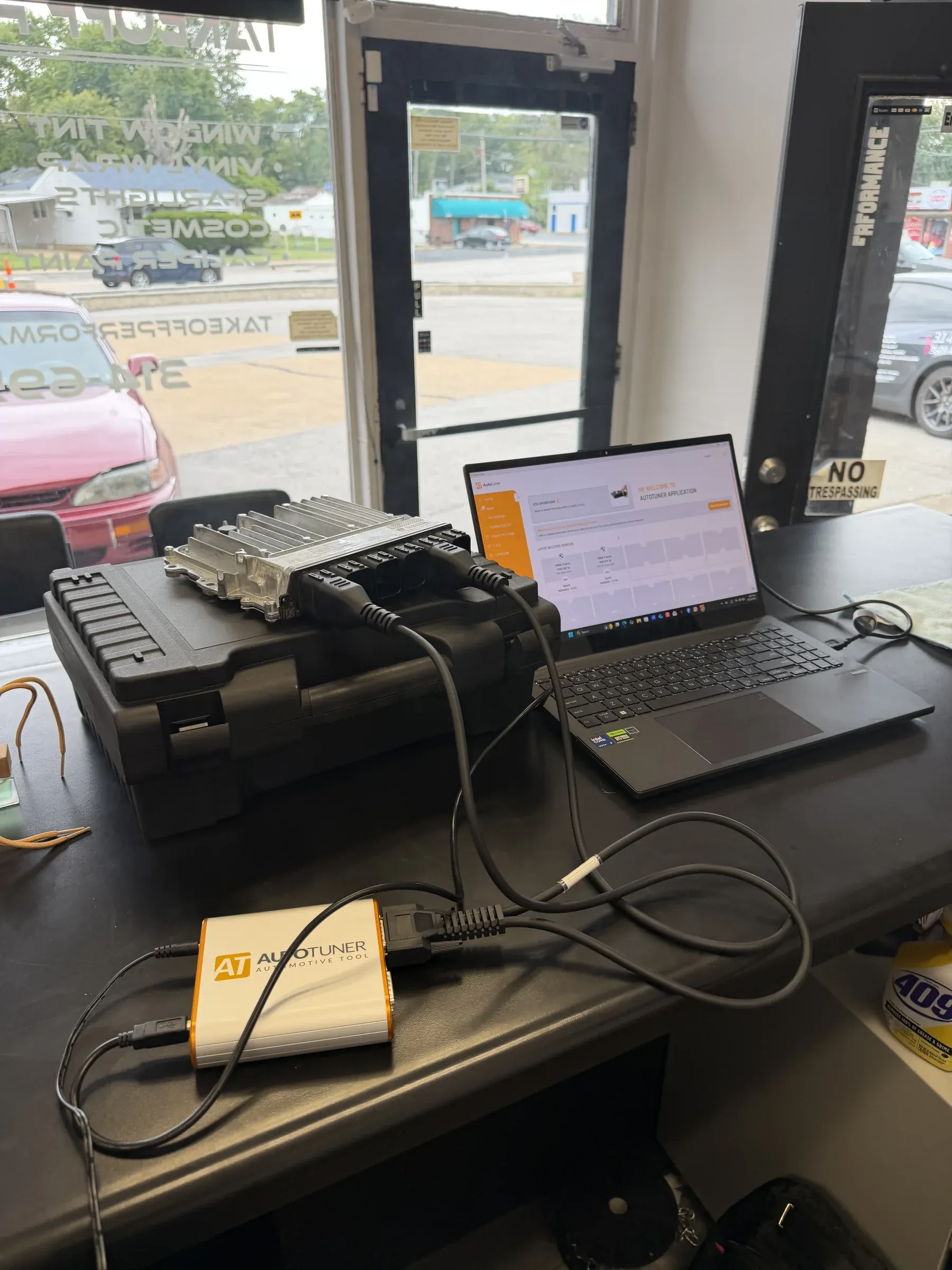 DME, laptop and tuning tool on the front desk