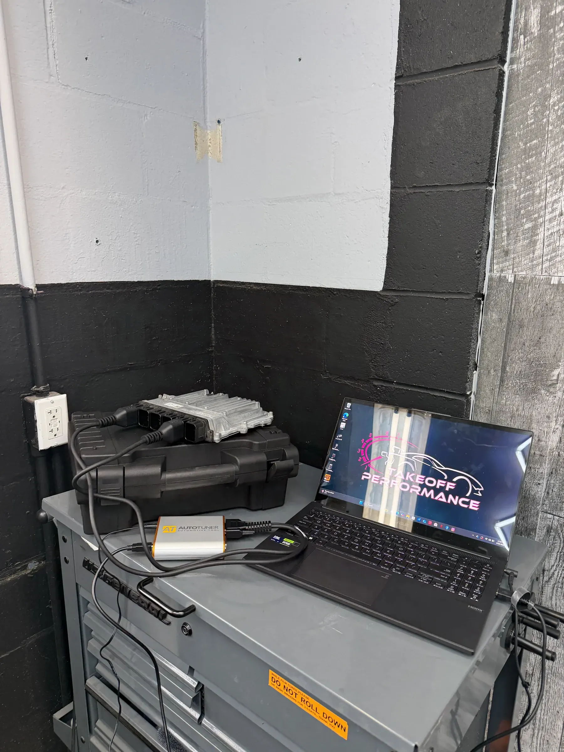 BMW DME on the bench connected to a laptop