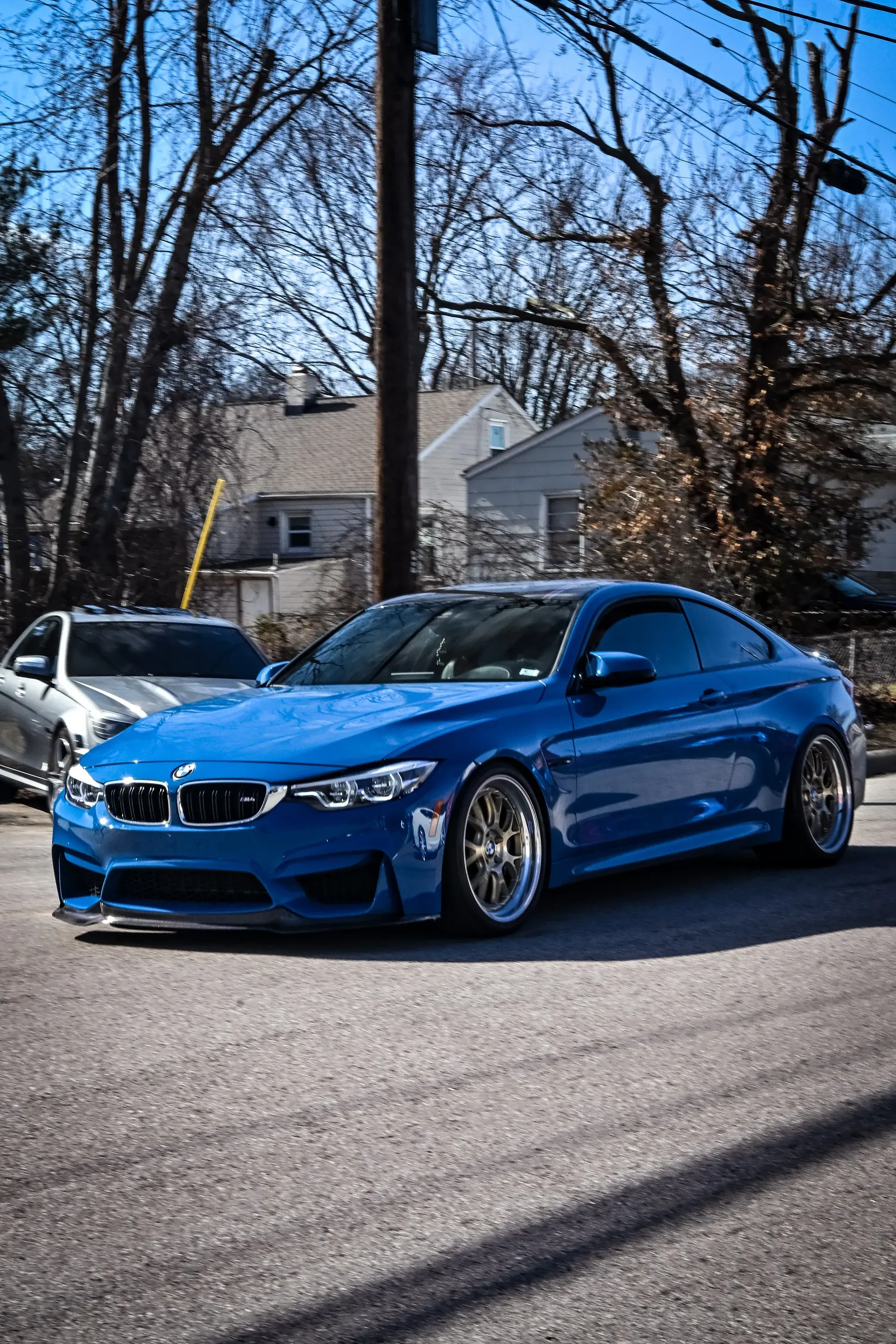 Blue BMW M4 with cosmetic upgrades