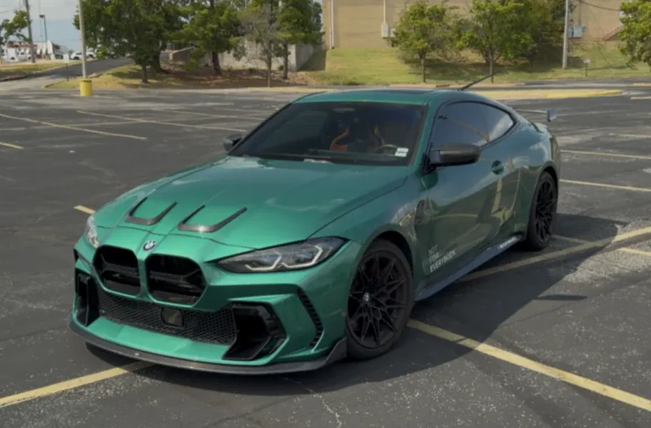 Green BMW M4, front three-quarter