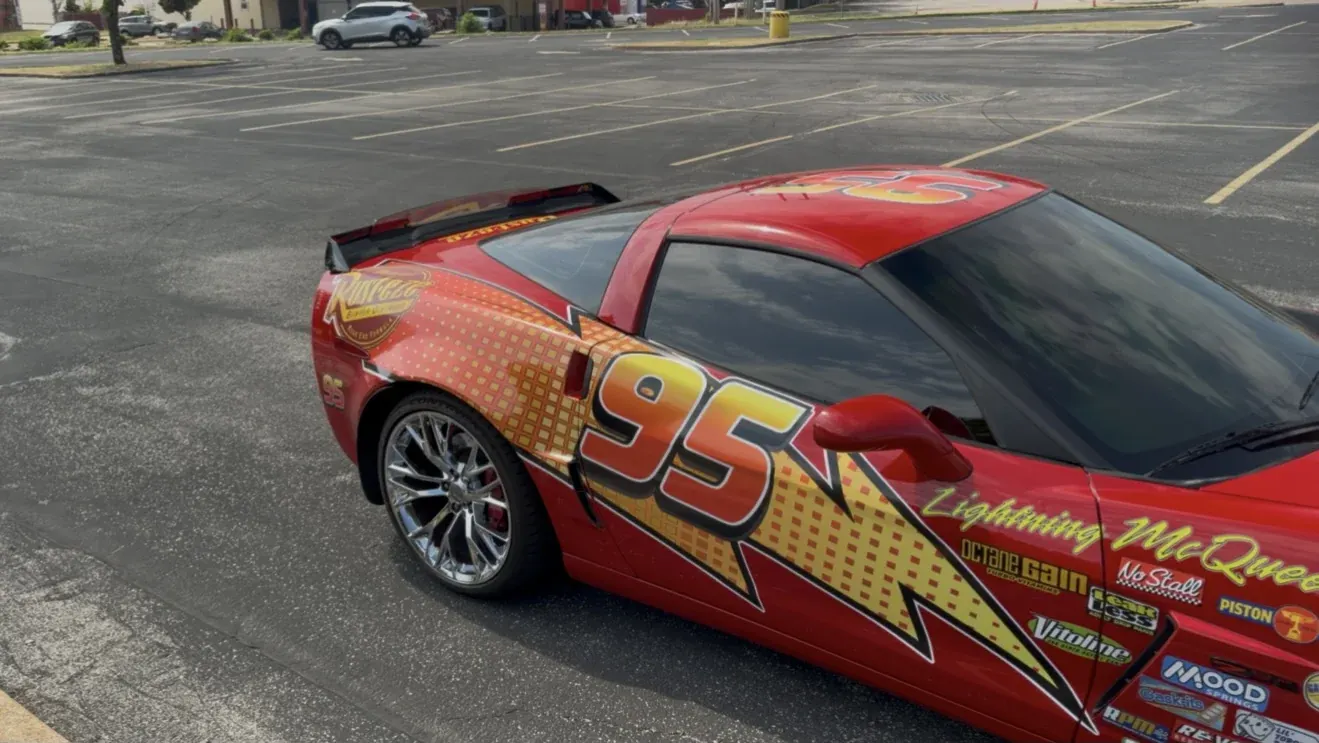 Lightning McQueen wrap on a Corvette, rear three-quarter